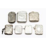 Seven various late 19th and early 20th Century silver vesta cases, one fluted; one plain and five