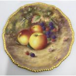 A Royal Worcester painted porcelain circular cabinet plate with wavy gilt gadroon rim, the entire