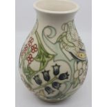 A Moorcroft ovoid vase, Golden Lily pattern, tubed lined with flowers on a cream ground, dated 1993,