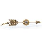 A late Victorian diamond set arrow brooch, the claw set central old European diamond weighing approx
