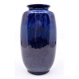 Ruskin Pottery: A Ruskin Pottery high fired blue drip glaze vase, height approx 20cm. Impressed