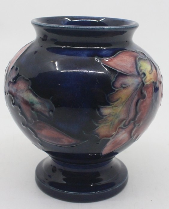 A Moorcroft pedestal ovoid vase, Orchid pattern, blue ground, impressed marks to base, approx 9cm