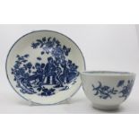 An 18th century Worcester blue and white tea bowl, painted with floral sprays and butterflies,