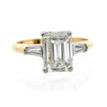 An 18ct yellow gold and diamond solitaire ring, the emerald-cut diamond weighing approx 2.9 carat,