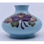 Moorcroft: Walter Moorcroft 'Columbine' squat vase. on a rare experimental Turquoise ground.