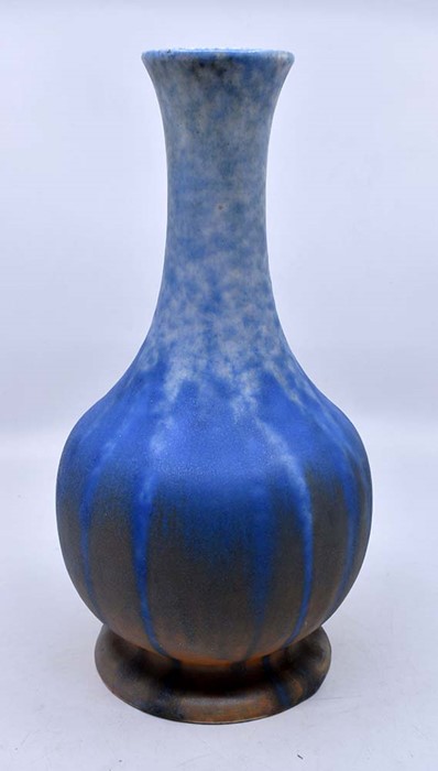 Ruskin Pottery: A Ruskin Pottery globe and shaft vase in a blue over orange crystalline glaze,