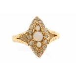 A Victorian opal and diamond 18ct gold ring, navette shaped set to the centre with three round opals