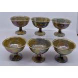 Ruskin Pottery: A Ruskin Pottery set of 6 pedestal footed bowls with speckled lustre glaze, height