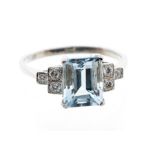 An aquamarine and diamond Art Deco style platinum dress ring, comprising a central claw set