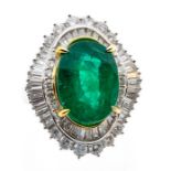 An emerald and diamond platinum cocktail ring, comprising a large  oval cut emerald, approx 14 x