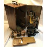 Reichert compound microscope 1921. Serial number 65158. With accessories in wooden case with key.