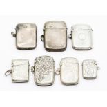 Seven various late 19th and early 20th Century silver vesta cases, two plain, one engine turned,
