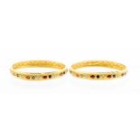 Two high carat yellow gold and enamel bangles of Indian Origin, comprising ornate turquoise, red and