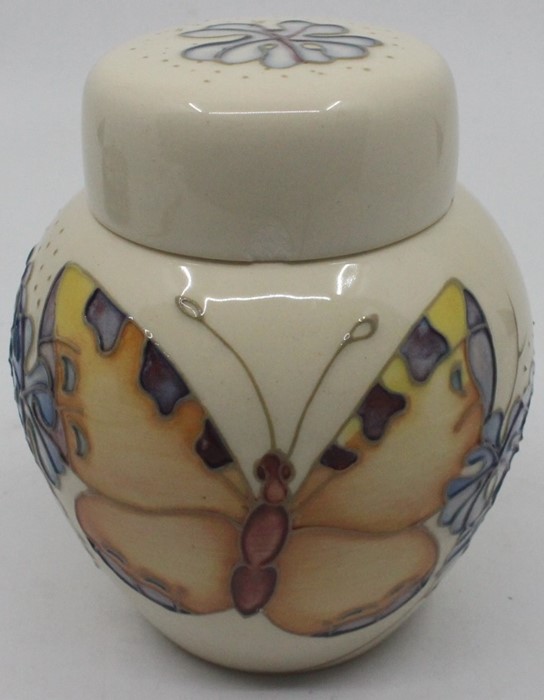 A Moorcroft ginger jar, butterflies and flowers on a cream ground, impressed marks to base, approx