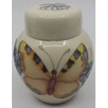 A Moorcroft ginger jar, butterflies and flowers on a cream ground, impressed marks to base, approx