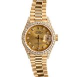 Rolex- a ladies 18ct gold Oyster Perpetual Datejust  diamond set Rolex wristwatch, gold tone dial