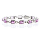 A pink sapphire and diamond 18ct white gold bracelet, comprising claw set rectangular cut