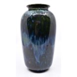 Ruskin Pottery: A Ruskin Pottery baluster vase in a high fired blue/green crystalline glaze,