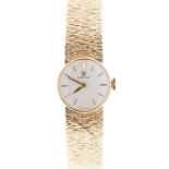 Omega- a 9ct gold ladies watch, round cream dial, baton markers, approx 17mm, with integral 9ct gold