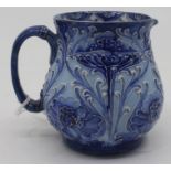 William Moorcroft - Macintyre & Co - A Florian Ware cream jug, printed marks and initialled in