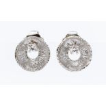 A pair of diamond and platinum stud earrings, textured organic circular design, claw set with