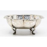 A Continental silver shaped octagonal circular bowl, foliate border above reticulated section, on