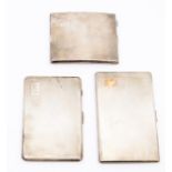 A collection of three various engine turned cigarette cases, two engraved with initials, all