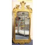 An early 19th Century Empire style hand carved and gesso edged gilded wall mirror, circa 1820, the