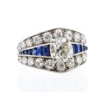 A diamond and sapphire 18ct white gold cluster ring, the central stone weighing approx 1.95carats,