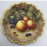 A Royal Worcester painted porcelain circular small cabinet plate with wavy gilt gadroon rim, the