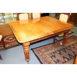A Victorian mahogany extending dining table, circa 1870, fitted with two removable leaves, moulded