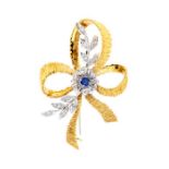 A diamond and sapphire 18ct yellow and white gold spray brooch, comprising a white gold flower set