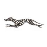 A diamond set brooch in the form of a racing greyhound, grain set with rose cut diamonds with a