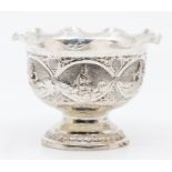 A Continental silver pedestal bowl, having six cartouches embossed with Eastern figures, wavy