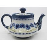 A William Moorcroft for MacIntyre teapot, poppy pattern, tubelined in tones of blue and green,