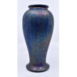 Ruskin Pottery: A Ruskin Pottery baluster vase in an iridescent blue glaze with purple overtones,