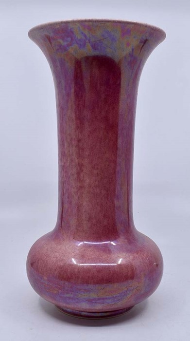 Ruskin Pottery: A Ruskin Pottery pink lustre glaze long neck globe and shaft vase, height approx