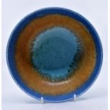 Ruskin Pottery: A Ruskin Pottery footed bowl with blue, fawn and turquoise glaze, diameter approx