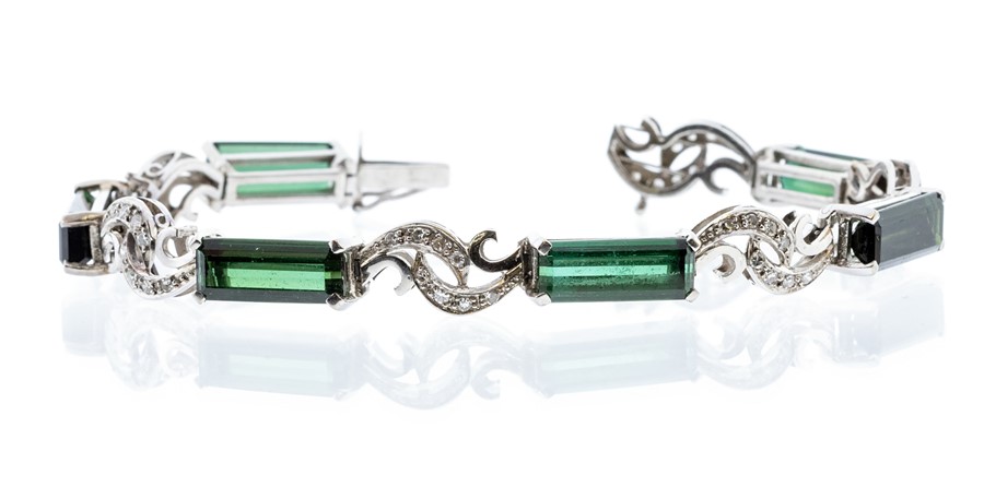 A green tourmaline and diamond set 18ct white gold bracelet, the elongated rectangular cut