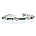 A green tourmaline and diamond set 18ct white gold bracelet, the elongated rectangular cut