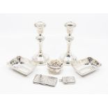 A collection of silver to include: a pair of shaped rectangular ring trays, reticulated borders,