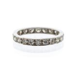 A platinum and diamond set full eternity ring, comprising round brilliant cut grain set diamonds