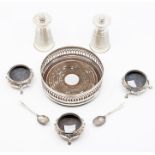 A collection of table silver to include: a set of three Victorian circular salts, floral