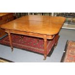 A late Georgian mahogany extending long dining table, circa 1825, complete with three removable