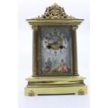 A 19th Century brass cased eight day mantel clock, probably French, the porcelain dial hand