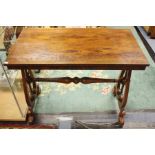 An early Victorian rosewood occasional table, raised on scrolled supports, carved feet, terracotta