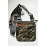 Prada Cross Body bag in dark green and grey.Zip compartments to the inner. Prada logo label (see