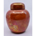 Ruskin Pottery: A Ruskin Pottery ginger jar and cover with orange lustre glaze, height approx