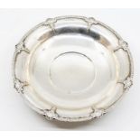 A George VI silver circular bowl, the egg-and-dart border punctuated with rocaille and wheat sheafs,