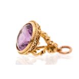 A late Victorian amethyst seal fob, round faceted amethyst approx 14mm encased within a fancy